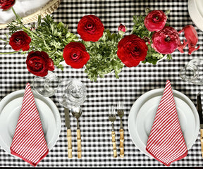 Striped dinner napkins - A set of striped dinner napkins beautifully displayed on a formal dining table.