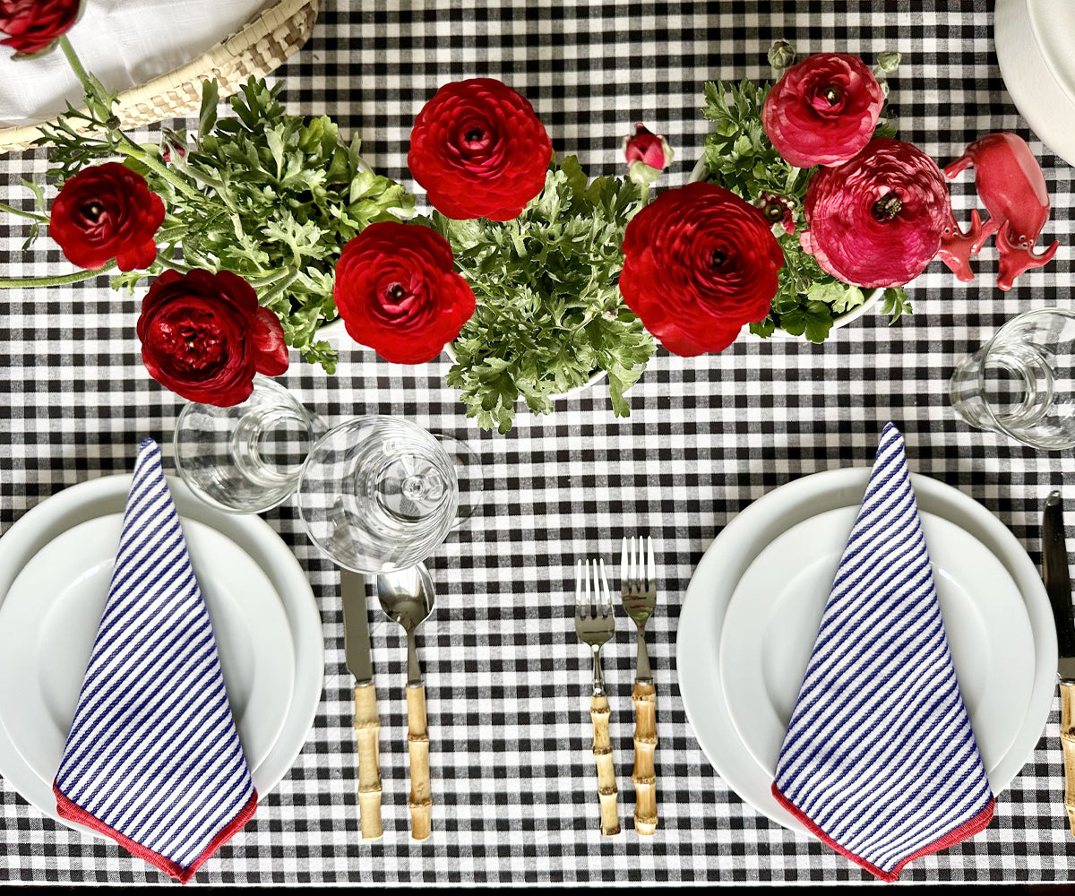 The cotton dinner napkins with striped patterns create visual interest on the table, adding depth and dimension to the overall decor.