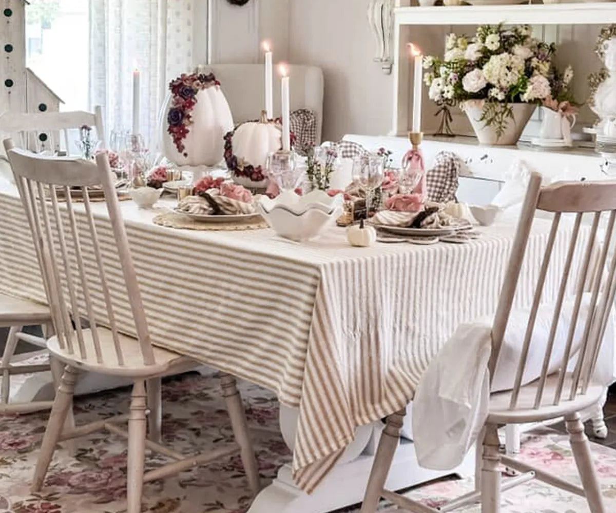 Beige and white striped cotton rectangle tablecloth on dining table