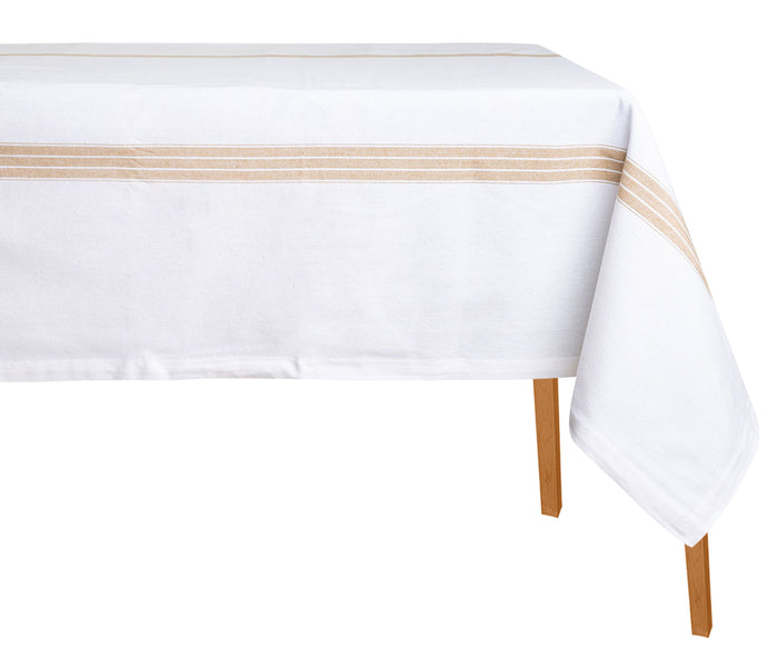 A white rectangular cotton tablecloth with a striped pattern on the edge, displayed on a table with wooden legs.