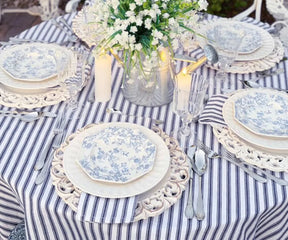 Machine washable navy blue and white striped tablecloth on modern dining table