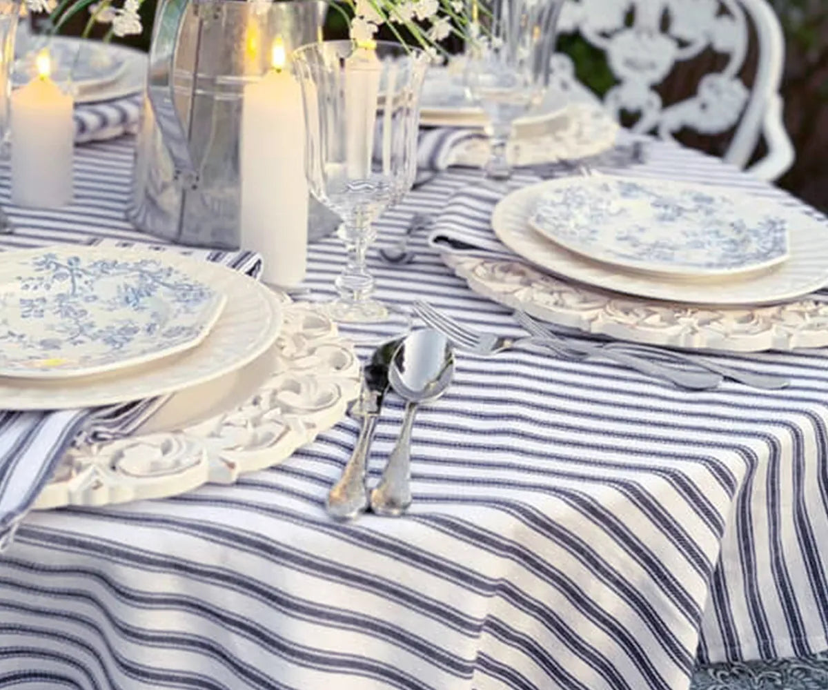 Navy blue and white ticking stripe tablecloth paired with table décor