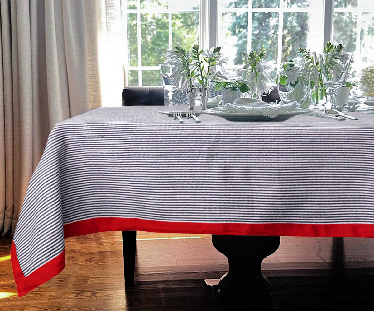 Navy tablecloth featuring vibrant red color stripes, perfect for a bold dining room statement.