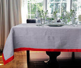 Navy tablecloth featuring vibrant red color stripes, perfect for a bold dining room statement.