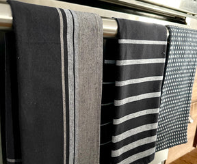Plush striped bath towels, combining style and functionality for a luxurious bathing experience.