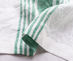 Verdant green cloth napkins, bringing a natural and refreshing ambiance to your dining experience.