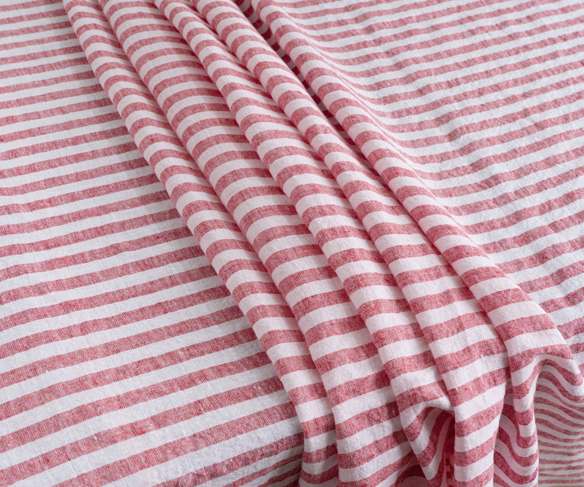 A red linen tablecloth specifically designed for a 6-foot table.