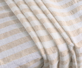 Striped tablecloth adding style and charm to your table setting.