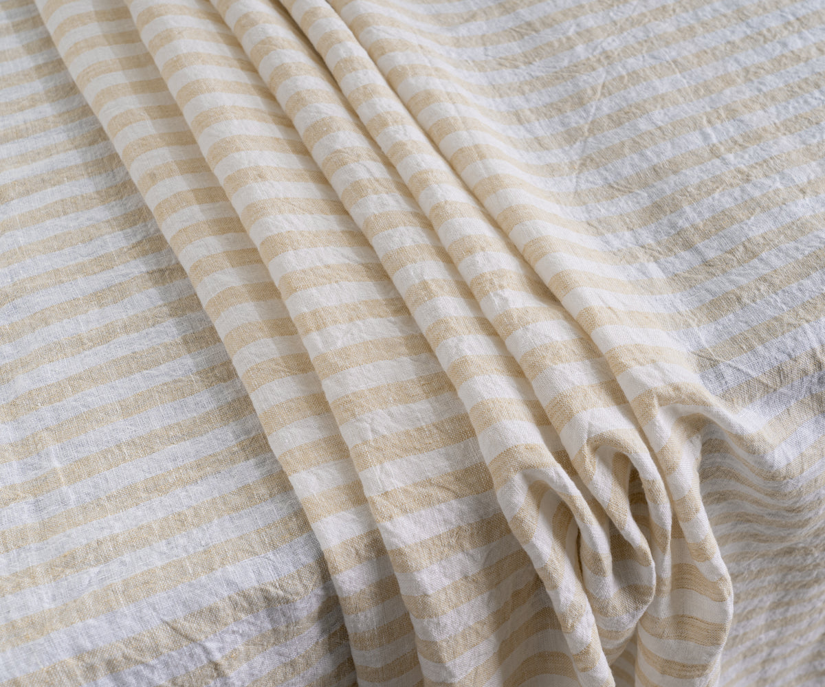 A stylish striped linen tablecloth for a touch of pattern.