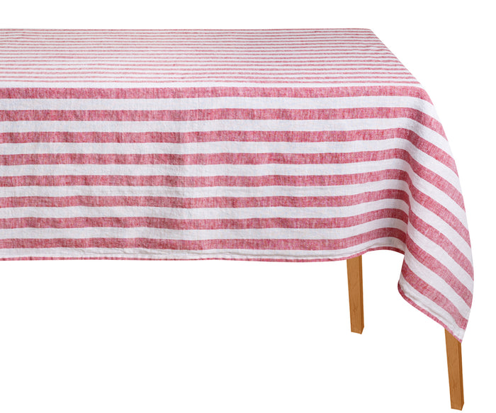 Red and white striped tablecloth on a wooden table with a white linen tablecloth background