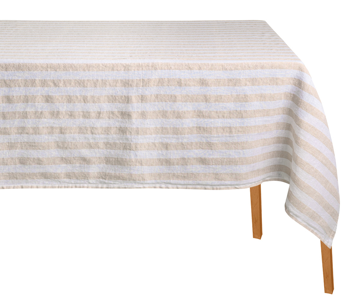 Striped tablecloth on a wooden table with a white background