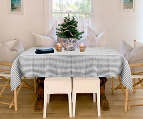 Stylish and durable stripe tablecloth made from premium linen, adding sophistication to any dining or event space.