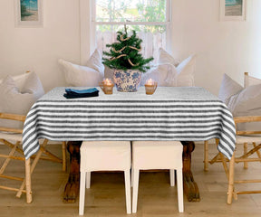 Timeless farmhouse linen tablecloth featuring classic stripes, blending rustic charm with durable, high-quality fabric.