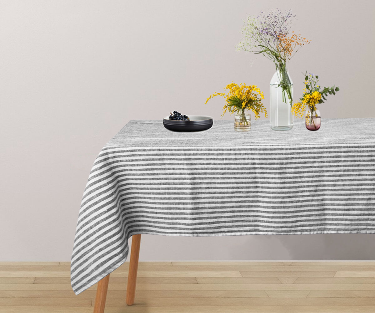 Linen tablecloth featuring an Amalfi stripe motif, bringing a touch of chic sophistication to your dining decor.