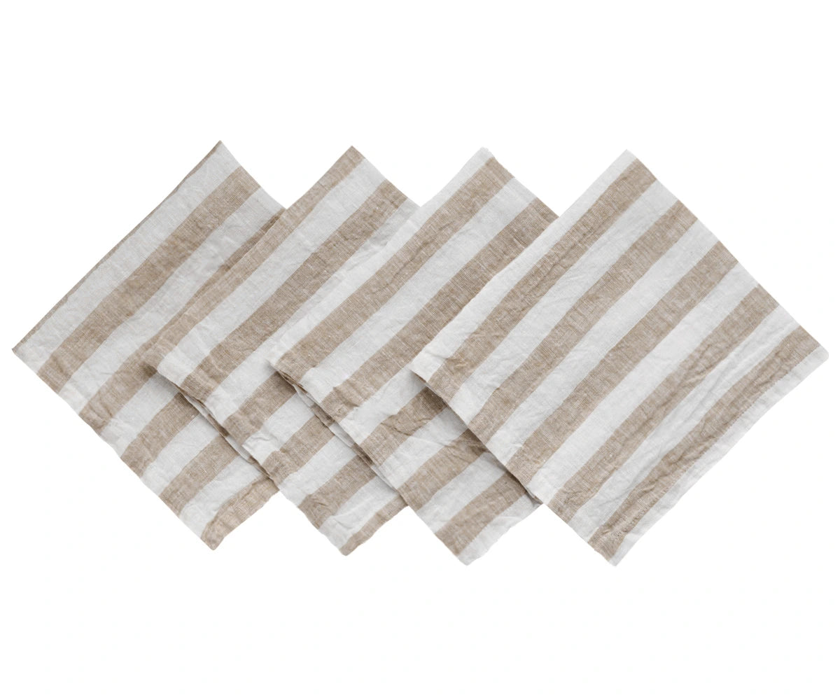 Four striped napkins with beige and white stripes on a white background