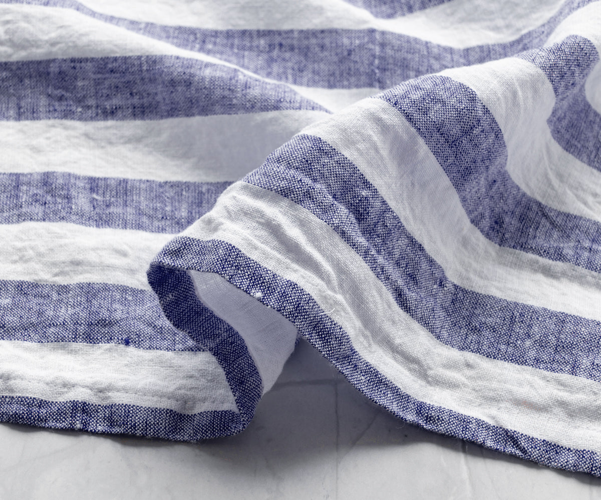 Blue and white Italian Stripe Napkins arranged on a surface