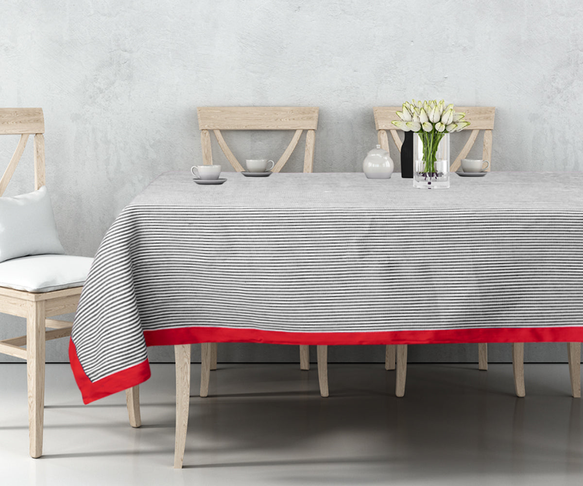 Our black cloth tablecloth has made the Size 60 X 109 with Black stripes and red border. 