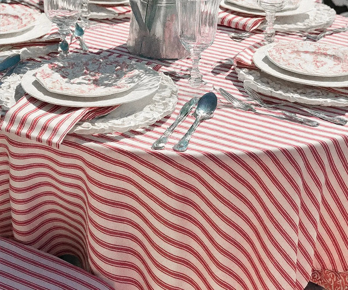 Stylish red and white striped tablecloth enhancing table decor for family meals