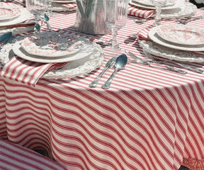 Stylish red and white striped tablecloth enhancing table decor for family meals