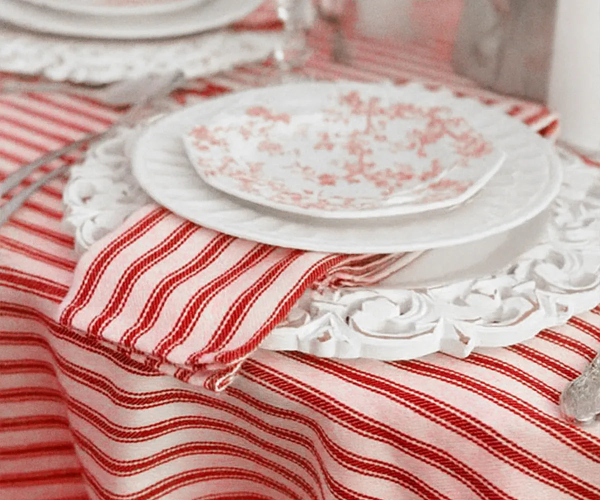 Machine-washable red and white striped tablecloth, perfect for kitchen or dining room