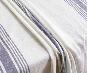 White linen tablecloth on a table with soft lighting