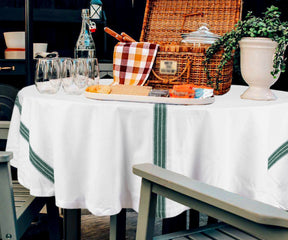 White round cotton tablecloth on dining table