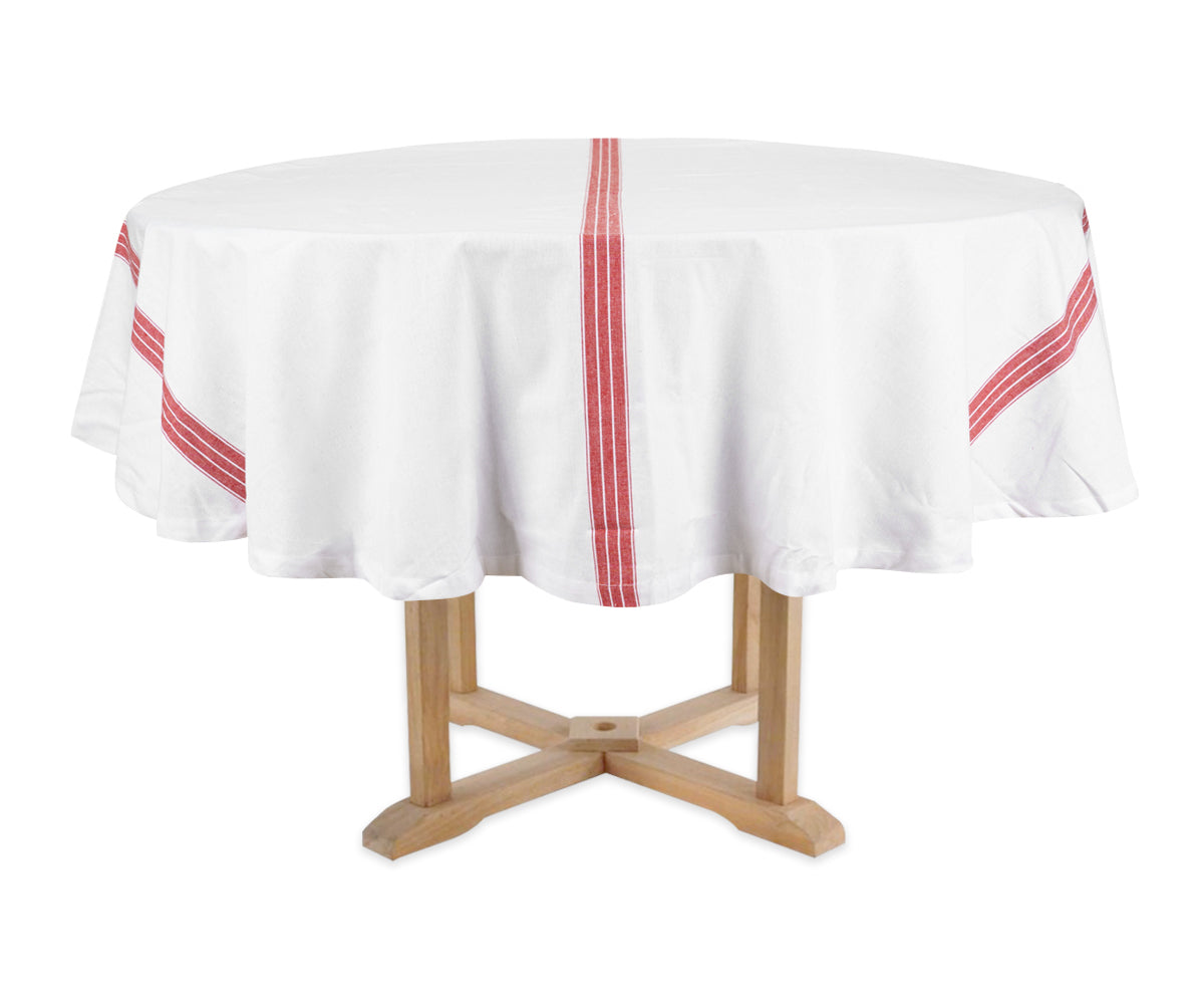 Round table with a white tablecloth featuring red stripes on a white background