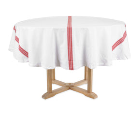 Round table with a white tablecloth featuring red stripes on a white background
