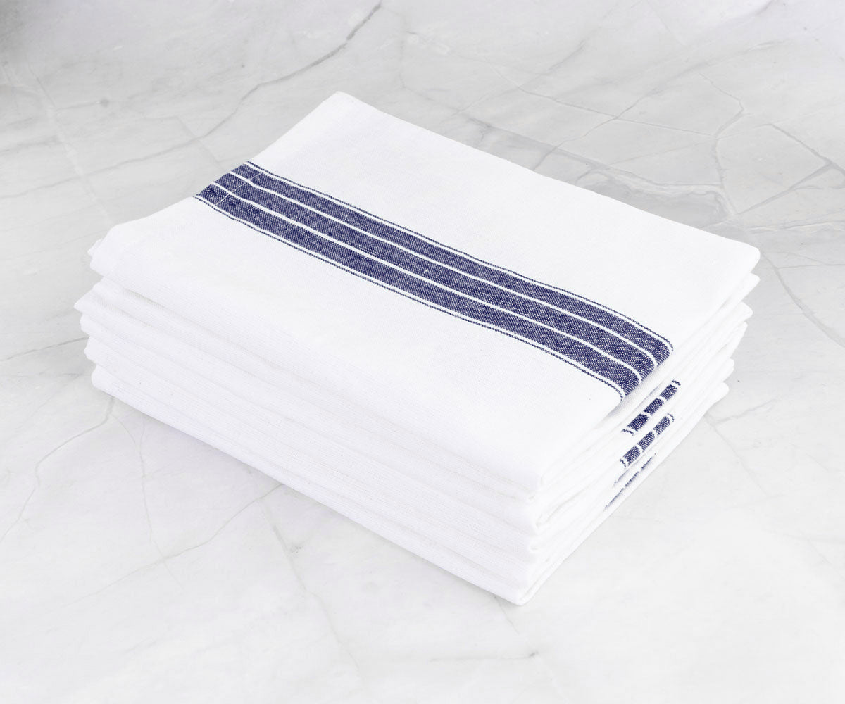 White dinner napkins, pristine and refined, elevate the elegance of your formal or casual dinner table.