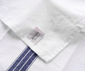 Striped cloth napkins, with their timeless pattern, bring a touch of sophistication to your dining arrangement.