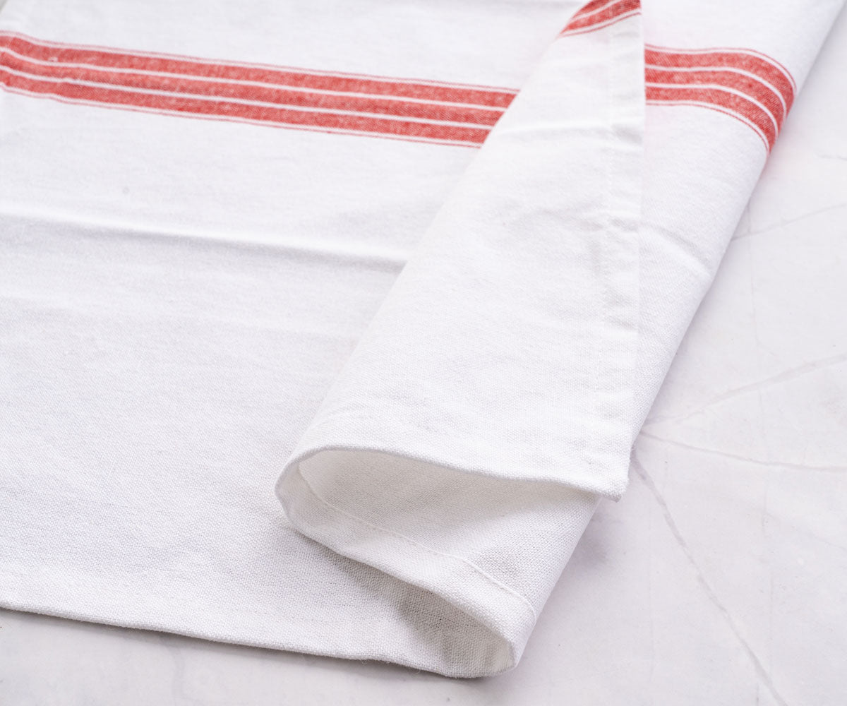 Red and white cloth napkins, with their bold contrast, make a striking statement on your dinner table.