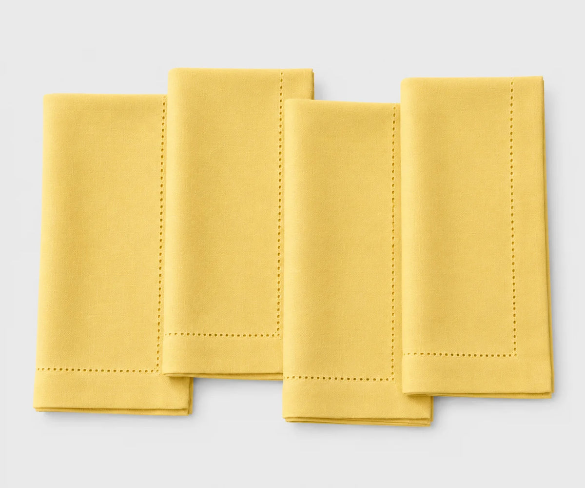 Bright sunflower yellow cotton hemstitch napkins, reusable washable cloth dinner napkins for weddings, festive table décor, parties, and everyday dining.