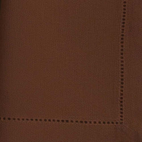 Close-up swatch of coffee brown hemstitch napkin fabric showing weave texture and border detail.