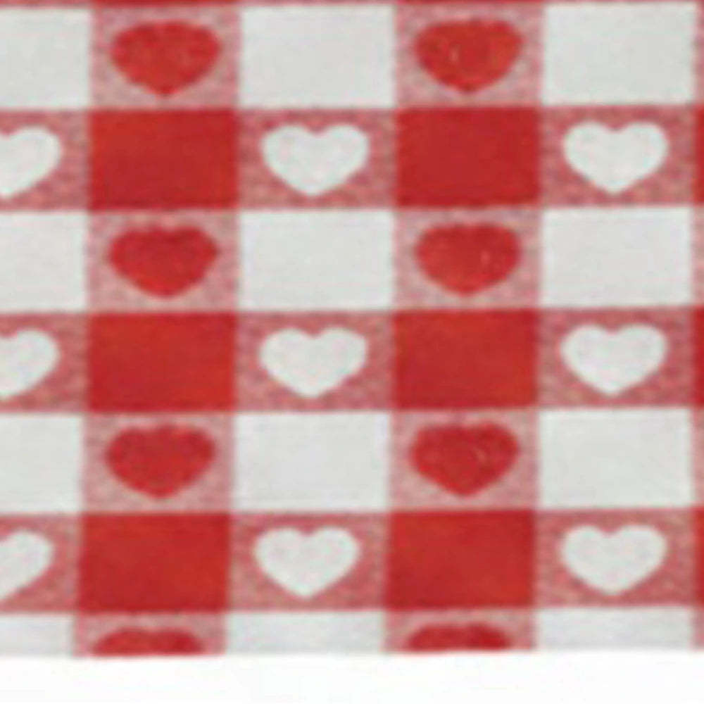 Red heart print detail on cotton tablecloth