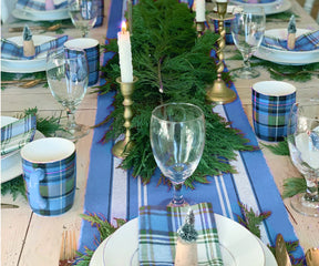 Long striped table runner ideal for outdoor dining.