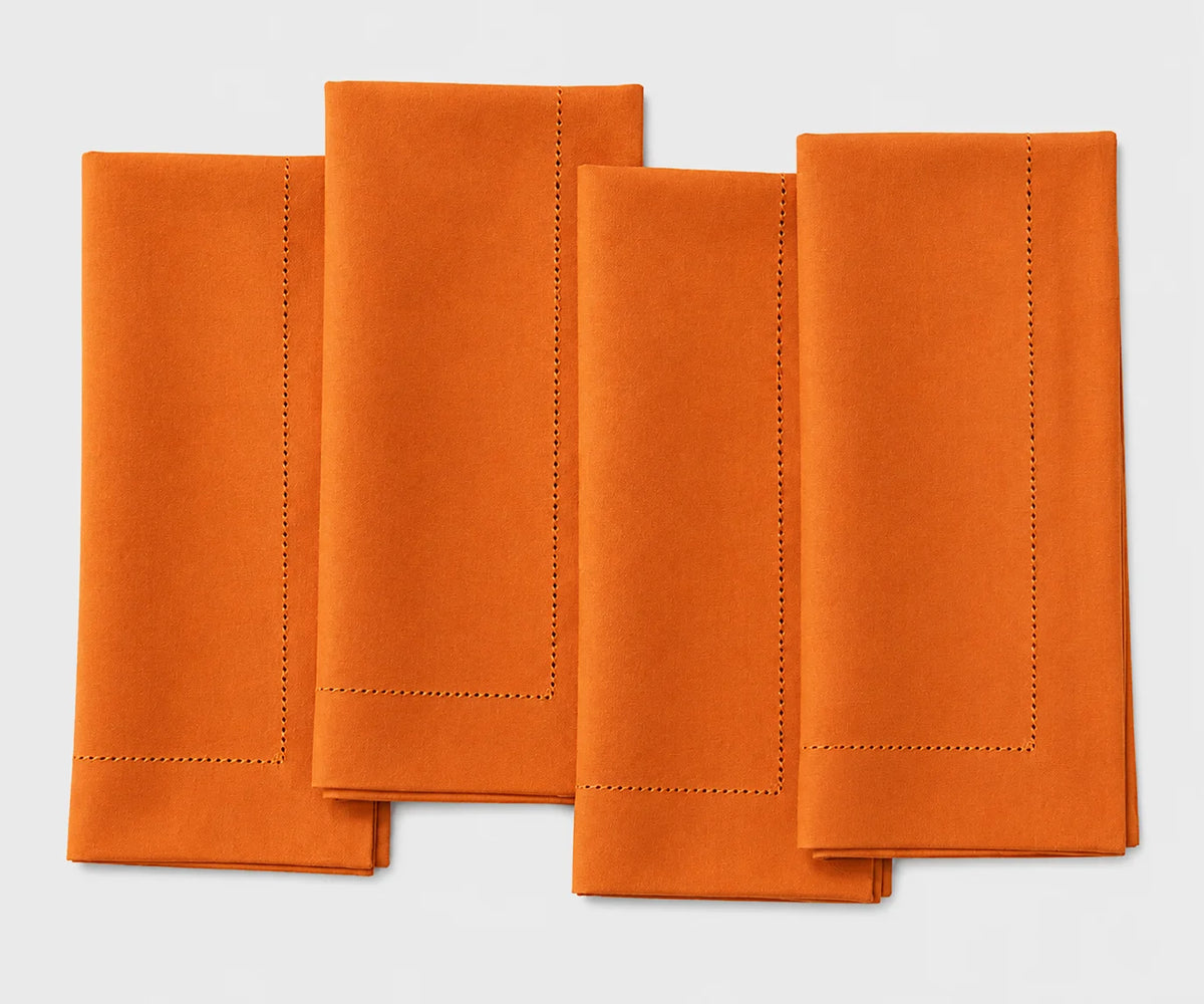 Vibrant tangerine cotton hemstitch napkins, reusable washable cloth dinner napkins for weddings, festive gatherings, holiday tables, and everyday dining.