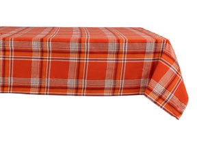 Bold orange-red plaid cotton tablecloth with white, black, and yellow checks on dining table