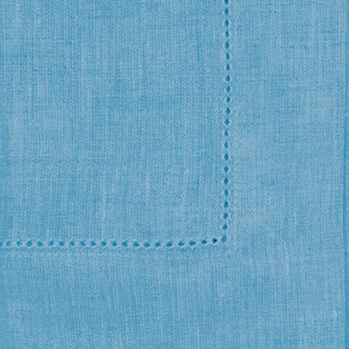 Set of teal cloth napkins in various sizes, styled with elegant tableware