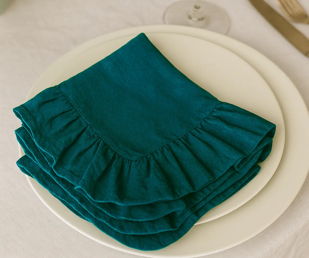 Teal cotton ruffle edge dinner napkins, reusable and washable cloth napkins for weddings, parties, holidays, and everyday dining table décor.