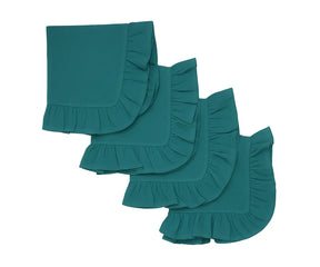 Teal ruffle edge cotton napkins neatly folded on a dining table
