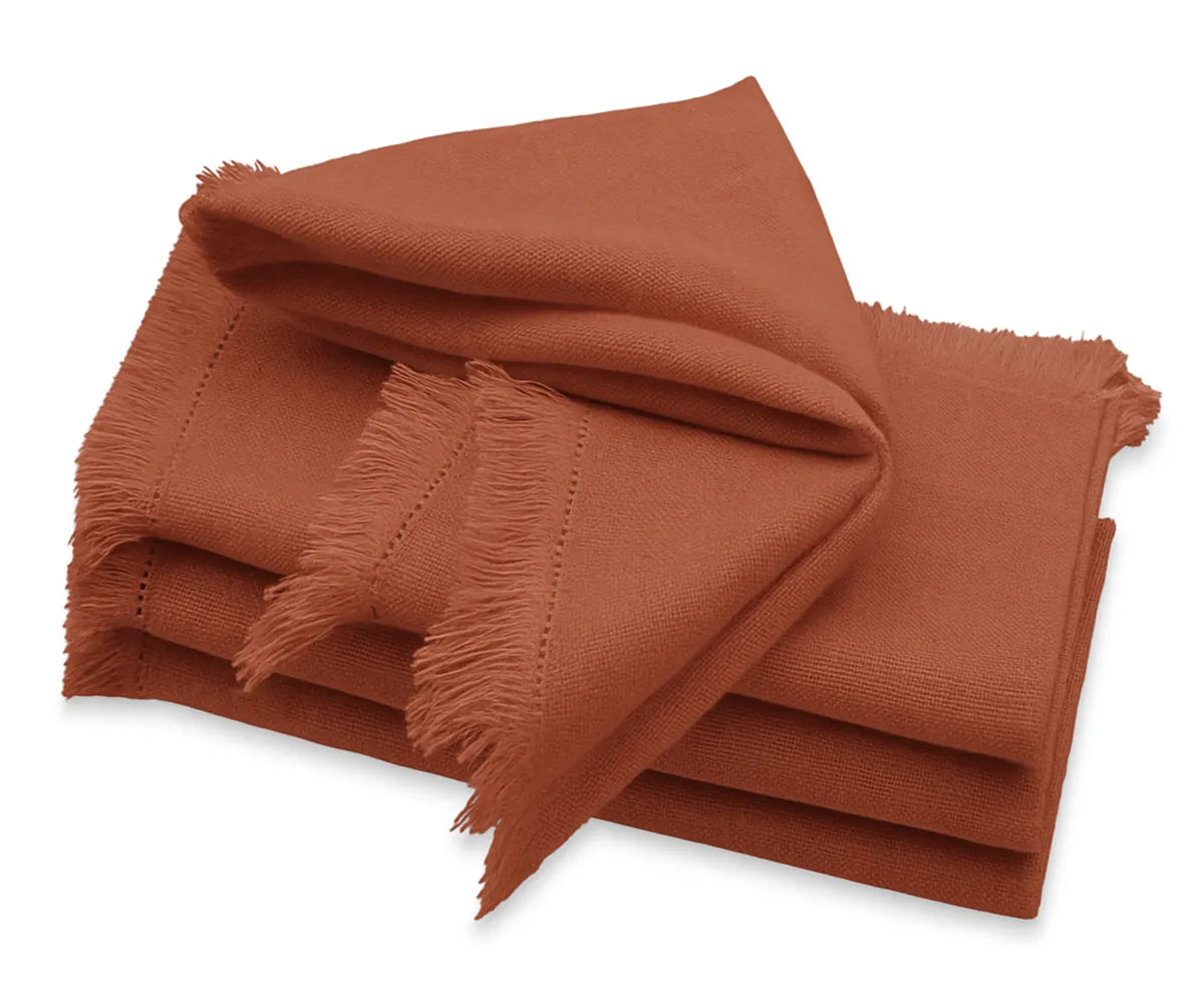 Terracotta cotton dinner napkins with fringed edges, reusable and stylish for weddings or holiday tables