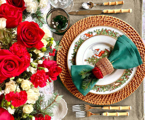 Elevate your dining table with green fabric placemats, providing charm and protection, creating a stylish and enjoyable mealtime experience.