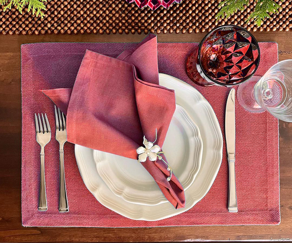 Red and patterned washable placemats for stylish dining decor.