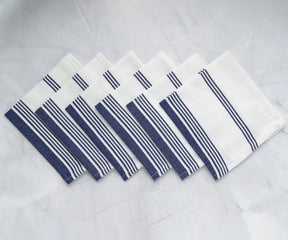 Blue cloth napkins arranged neatly, adding a pop of color to the table.
