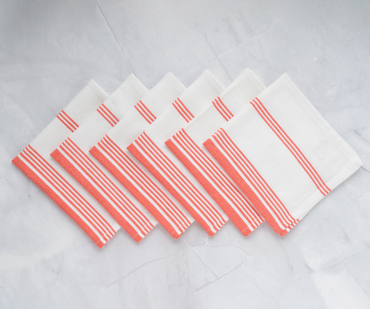coral napkins, displaying delicate and refined edges.