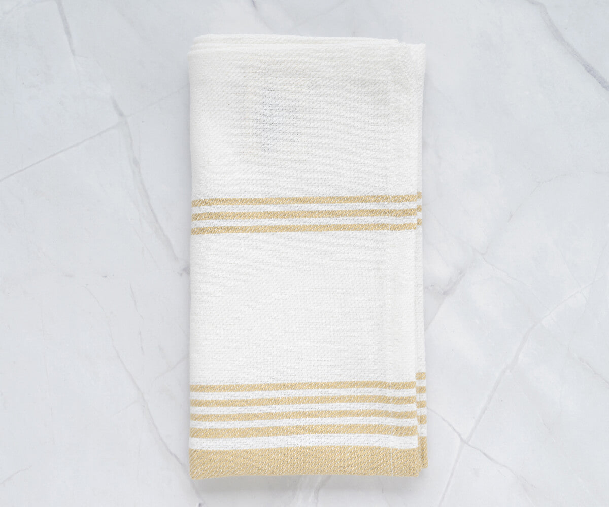 Elegant beige cloth napkins, displaying intricate designs and craftsmanship.