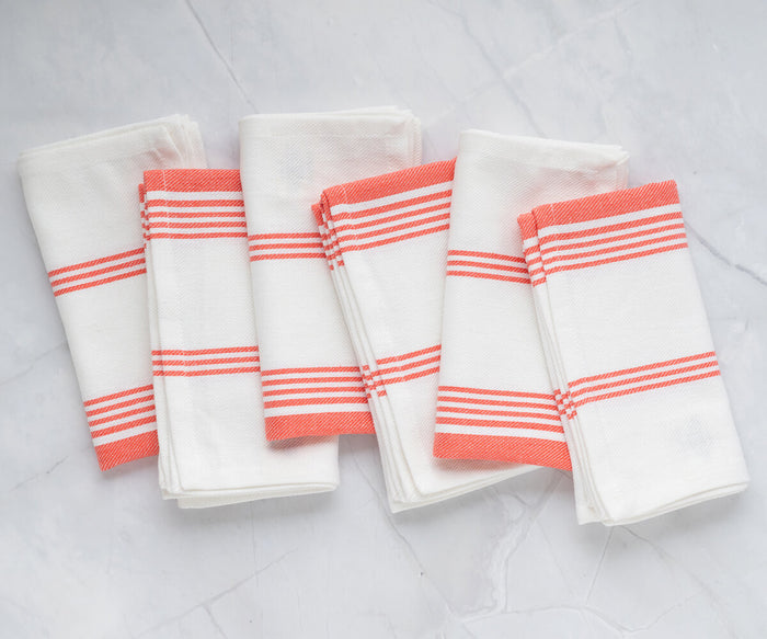 Vibrant orange napkins, adding a pop of color to the table arrangement.