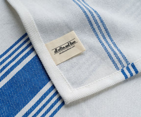Cloth napkins with a touch of blue stripes, exuding luxury and refinement.