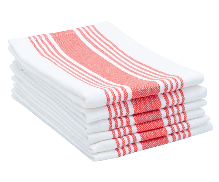 Red cloth napkins, adding warmth and earthiness to the dining arrangement.