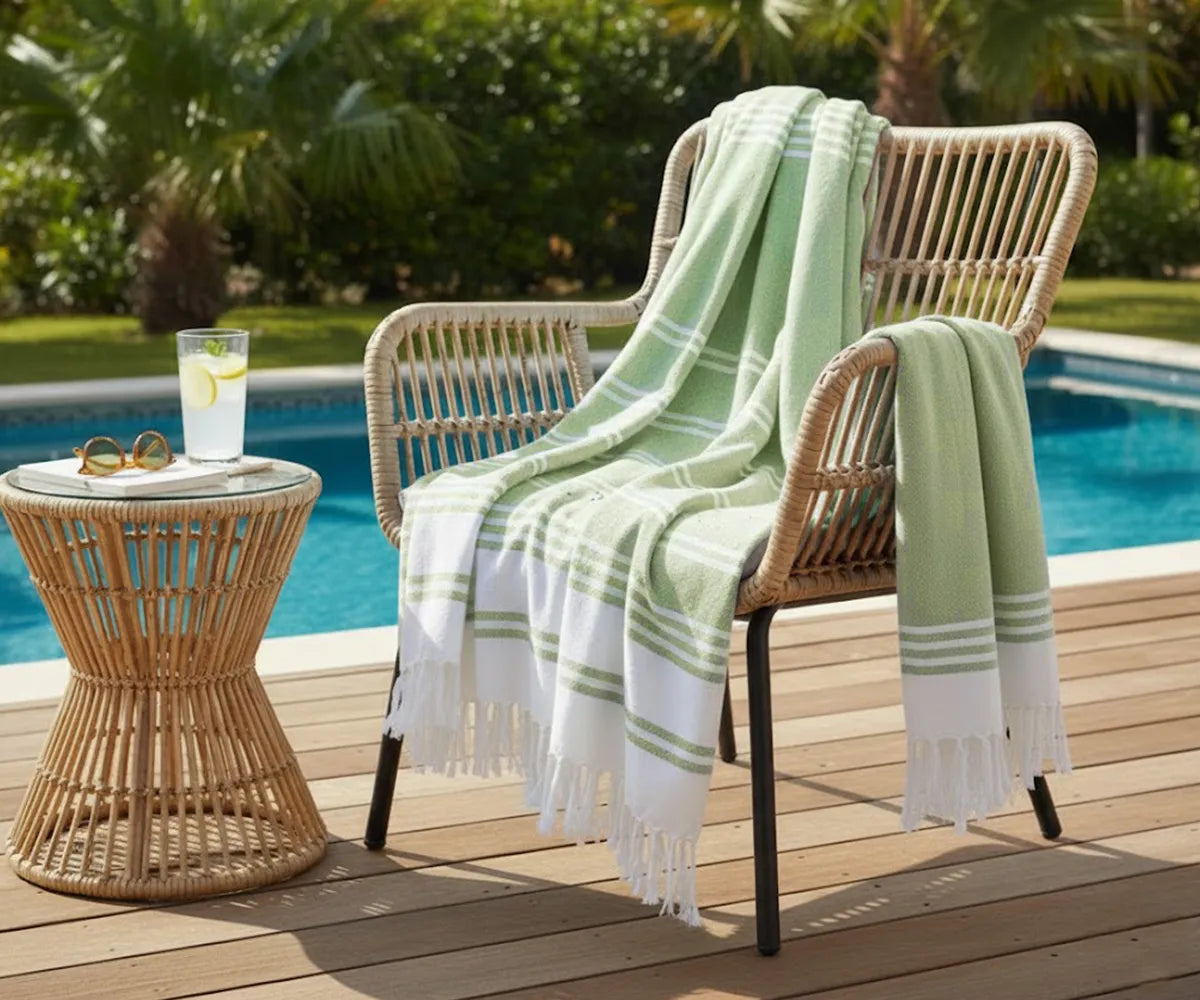 Set of 2 sage green 100% cotton Turkish beach towels with white stripes, soft, absorbent, and durable, perfect for bath or beach use.